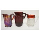 1290	3 GLASS PITCHERS CONTEMPORARY CARNIVAL, RED DEPRESSION, & ANTIQUE RUBY STAINED HOBNAIL. TALLEST