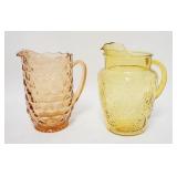 1291	2 GLASS PITCHERS PINK & LIGHT AMBER. TALLEST IS 9 IN 