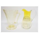 1292	TWO GLASS PITCHERS; DEPRESSION YELLOW POPPY, HAS A LARGE FLAKE ON THE UNDERSIDE, & A BLOWN PITC