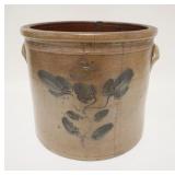 1007	PRUDEN & OLCOTT BLUE DECORATED CROCK, 4 GALLON, 185 DUANE ST NY, HAS A HAIRLINE DOWN THE FRONT 