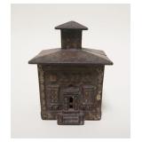 1025	*BANK* STILL BANK, CAST IRON, 2 5/8 IN WIDE X 3 1/2 IN HIGH
