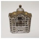 1029	*BANK* STILL BANK, GOLD & SILVER DECORATION, CAST IRON, 3 7/8 IN WIDE X 5 IN HIGH
