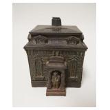 1040	*HOME BANK* BUILDING STILL BANK W/MAN IN DOORWAY, CAST IRON, 3 5/8 IN WIDE X 4 1/4 IN HIGH