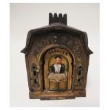 1047	*MAGIC BANK* MECHANICAL BANK CASHIER W/TRAY TURNS TO INSERT COIN, BROWN & GREEN PAINT DECORATIO