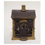1053	*BANK* STILL BANK, GOLD PAINT TRIM, CAST IRON, 3 3/4 IN WIDE X 5 1/4 IN HIGH