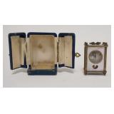 1067	MINIATURE MOTHER OF PEARL & BRASS CLOCK IN ORIGINAL BOX, BASE OF CLOCK IS MARKED *LANCEL SWISS,