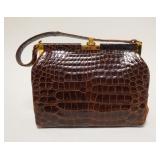 1068	NADELLE ALIGATOR PURSE, HAS WEAR ON THE HANDLE EDGES