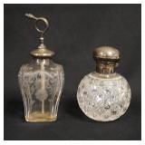 1110	2 CUT GLASS PERFUME BOTTLES, ONE HAS AN ENGLISH STERLING SILVER CAP & CORK STOPPER, OTHER IS AN