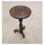 1136	CARVED ROUND PEDESTAL STAND, HAS CHIP ON THE PEDESTAL, WEAR ON TOP, 16 IN DIAMETER X 28 1/2 IN 