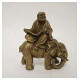 1229	SMALL BRONZE ASIAN MAN READING A SCROLL ON AN ELEPHANT, 4 1/2 IN H 