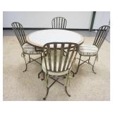 1255	IRON BASE TABLE & 4 CHAIRS, TOP IS CONCRETE W/INSET TILES, 43 1/2 IN DIAMETER X 29 1/2 IN HIGH