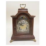 1292	WARMINK MINIATURE BRACKET CLOCK, HAS CHIME, NO KEY, 6 3/4 IN WIDE X 9 1/2 IN TOP OF HANDLE