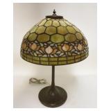 1001	ANTIQUE LEADED SLAG GLASS TABLE LAMP, HAS DAMAGE AT THE TOP OF THE SHADE CAUSING GAPS, HAS 4 OR
