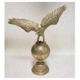 1025	HEAVY BRASS EAGLE ON GLOBE 20 1/2 IN H 18 1/2 IN W 
