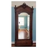 1032	CARVED VICTORIAN ARMOIRE W/ BEVELED MIRROR DOOR & FULL FLUTED COLUMNS, HAS A DRAWER BENEATH. 97