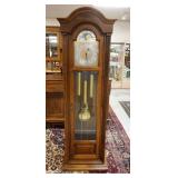 1034	HOWARD MILLER TALL CASE CLOCK, NO. 155 TRIPLE CHIME, MODEL #610-109 77 1/4 IN H 24 IN W 13 1/2 