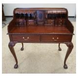 1042	CARVED MAHOGANY 2 PIECE DESK HAS BALL & CLAW FEET FRONT & BACK, HAS 2 DRAWERS PLUS MULTIPLE DRA