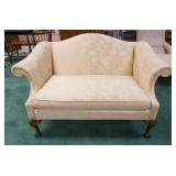 1043	HUMP BACK LOVE SEAT W/ BALL & CLAW FEET & BROCADE UPHOLSTERY. 58 1/2 IN W, 35 1/4 IN H 34 IN DE