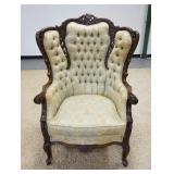 1045	HEAVILY CARVED UPHOLSTERED ARMCHAIR W/ TUFTED BACK 36 IN W, APP. 27 IN DEEP 47 3/4 IN H 
