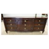 1056	KARGES 9 DRAWER LOW CHEST FLUTED 3/4 COLUMNS & TURNED FEET & CARVED FLORAL ROSETTES. 80 1/2 IN 