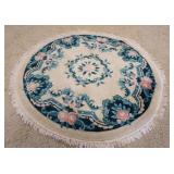 1061	ROUND FLORAL RUG, 6 FT 3 IN. HAS SOME STAINING