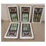 1065	5 STAINED GLASS WINDOWS FOUR ARE MATCHED  HAVE SOME CRACKS & PAINT LOSS. 31 IN X 17 3/4 IN ONE 