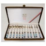 1219	SET OF 12 ASIAN SMALL FORKS & SPOONS W/ ENAMELED HANDLES DEPICTING CRANES. FORKS ARE 5 1/2 IN, 
