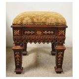 1223	ORNATE STOOL W/ UPHOLSTERED TOP, HAS CRACKS WHERE THE LEGS JOIN THE BODY