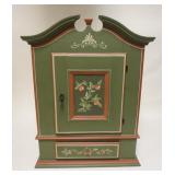 1226	DIMINUTIVE PAINT DECORATED HANGING WALL CABINET W/ ACRHED PEDIMENT TOP. 37 IN H X 21 1/2 IN W, 