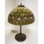 1001	ANTIQUE LEADED SLAG GLASS TABLE LAMP, HAS DAMAGE AT THE TOP OF THE SHADE CAUSING GAPS, HAS 4 OR