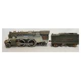 1115	LIONEL STANDARD LOCOMOTIVE 385E  &  TENDER. LOCOMOTIVE APP. 13 1/2 IN L. TENDER HAS SOME PAINT 
