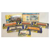1157	LOT OF AHM TRAIN MODELS/BUILDING KITS. LOT INCLUDES 5 HO GAUGE, ONE MINIATURE CONSTRUCTION W/ D