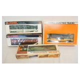 1245	4 LIONEL MODEL TRAINS, THREE O & O 27 GAUGE ONE LUISVILLE & NASHVILLE DUMP CAR