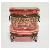 1062	CRANBERRY ENAMLED VICTORIAN DRESSER BOX IN A BRASS FRAME, 4 IN HIGH X 3 3/4 IN DIAMETER