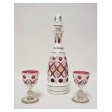 1068	WHITE CUT TO CRANBERRY DECANTER & 2 WINES, HAND PAINTED FLORAL DECORATION, SMALL NICK ON THE RI