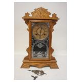 1074	ANSONIA OAK GINGERBREAD CLOCK, HAS STRIKE, 13 1/4 IN WIDE X 20 1/4 IN HIGH