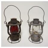 1121	PAIR OF DIETZ RAILROAD LANTERNS, ONE W/RED GLOBE, APPROXIMATELY 10 IN HIGH