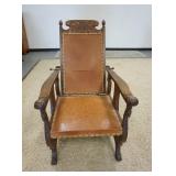 1163	CARVED OAK MORRIS CHAIR W/LEATHER SEAT & BACK, UNUSUAL SIDE CUT OUTS & CARVINGS ON BIRDS