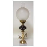 1217	DARK RUBY CUT TO CLEAR LAMP W/FROSTED WHEEEL CUT GLOBE, BRASS & MARBLE BASE, BRUISE AT THE TOP 
