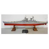 1258	WOODEN MODEL OF THE USS MISSOURI, HAS MOTOR & REMOTE CONTROL, BASE IS 2 WOODEN HAWAIIAN BOOKEND