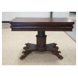 1293	CLAW FOOT EMPIRE FLIP TOP GAME TABLE, WITH CARVED PEDESTAL AND SKIRT, 41 3/4 IN X 20 1/2 IN CLO