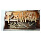1318	ANTIQUE WOOD WORKING CHEST WITH CARVING TOOL, SQUARES, ETC.