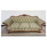 1324	VICTORIAN SOFA W/CARVED CORNUCOPIA ARMS OVER WINGED PAW FEET, UPHOLSTERY WORN