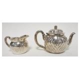 1009	STERLING SILVER TIFFANY & CO. TEAPOT & CREAMER, INSCRIBED UNDERNEATH & DATED 1894 16.2 TROY OUN