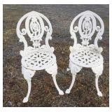 1051	PAIR OF ORNATE CAST IRON CARDEN/PATIO CHAIRS