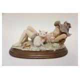1064	G ARMANI FIGURE OF YOUNG GIRL SLEEPING W/HER CAT, APPROXIMATELY 12 IN LONG X 8 IN HIGH