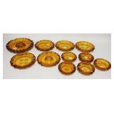 1093	11 AMBER FOSTORIA COIN GLASS ASHTRAYS LARGEST 10 IN 