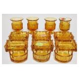 1094	AMBER FOSTORIA COIN GLASS SMALL ASHTRAYS/CIGARETTE URNS. LOT INCLUDES FOUR CIGARETTE URNS & NIN