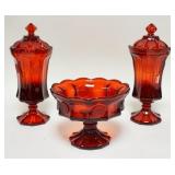 1100	3 PIECES OF RUBY RED FOSTORIA COIN GLASS LOT INCLUDES ONE COMPOTE & TWO COVERED URNS. URNS APP.