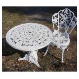 1153	FANCY CAST IRON TABLE & CHAIR, TABLE HAS OPENING FOR AN UMBRELLA, 26 1/2 IN DIAMETER X 24 3/4 I